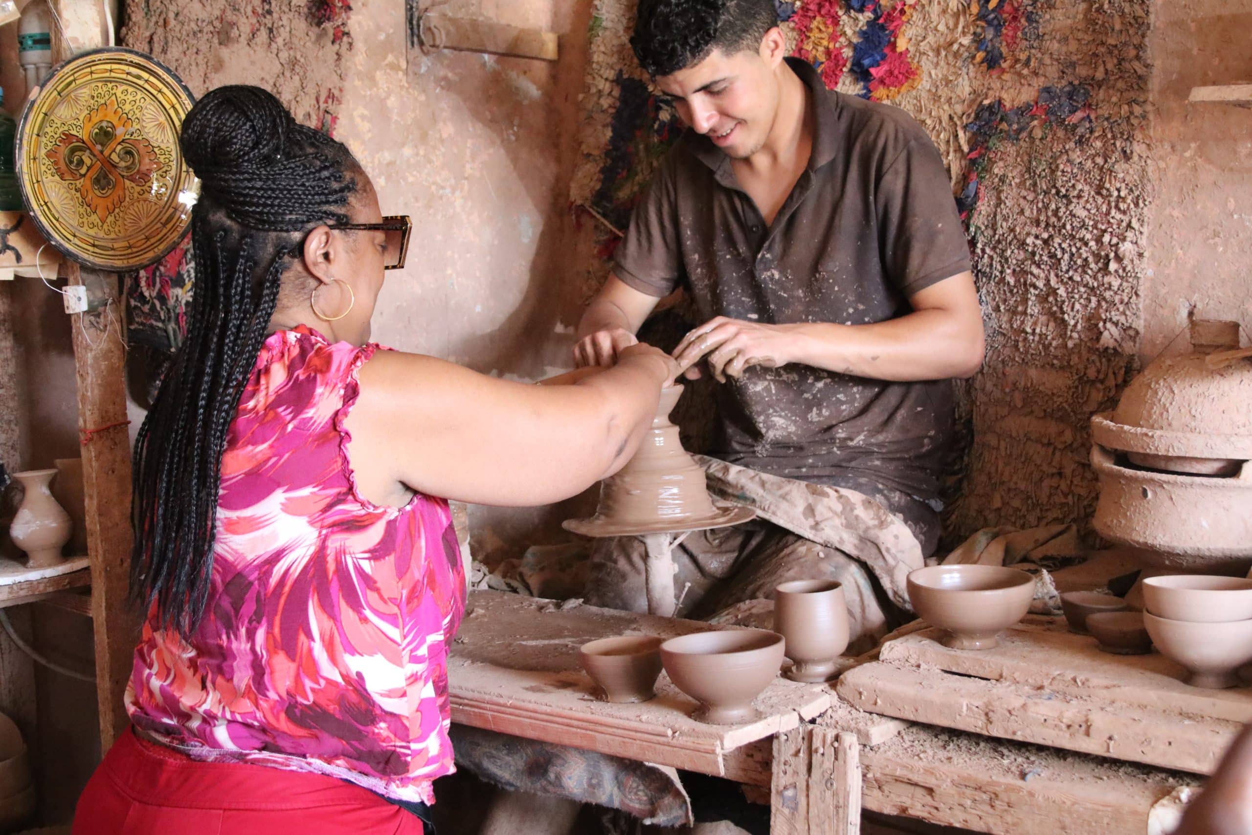 WTA Traveler participating in a traditional pottery workshop WTA Traveler participating in a traditional pottery workshop