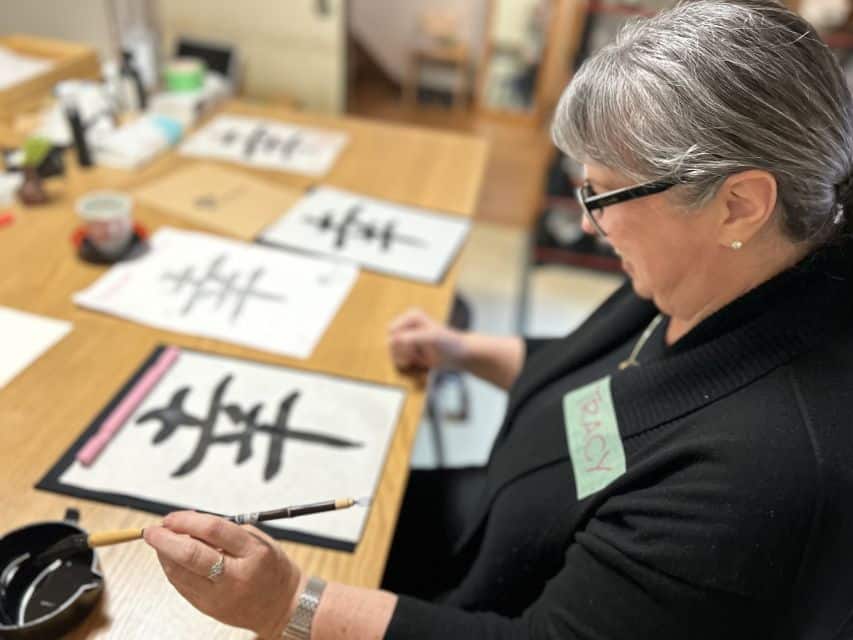 Solo traveler learning Japanese calligraphy in Kyoto Solo traveler learning Japanese calligraphy in Kyoto