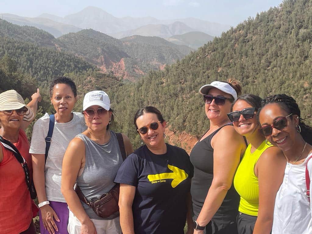 WTA women’s travel group enjoying a scenic mountain view together
