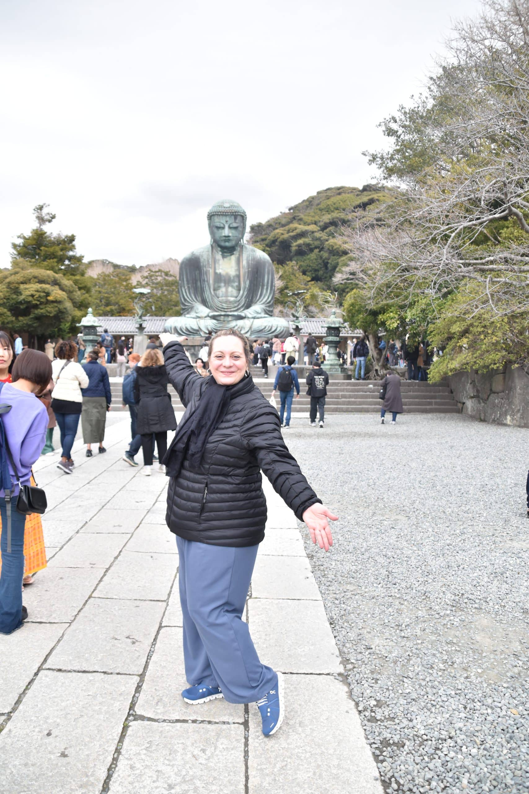 WTA traveler confidently standing with a backpack, overlooking a bustling cityscape in Japan WTA traveler confidently standing with a backpack, overlooking a bustling cityscape in Japan