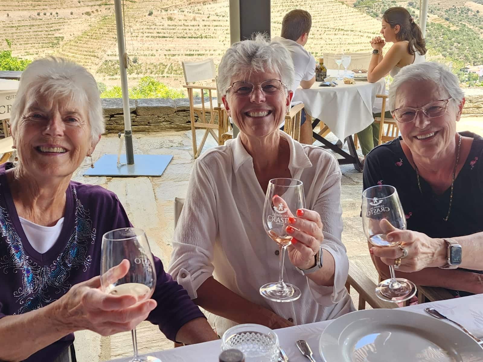 WTA traveler enjoying wine and dinner outdoors in Tuscany, Italy WTA traveler enjoying wine and dinner outdoors in Tuscany, Italy