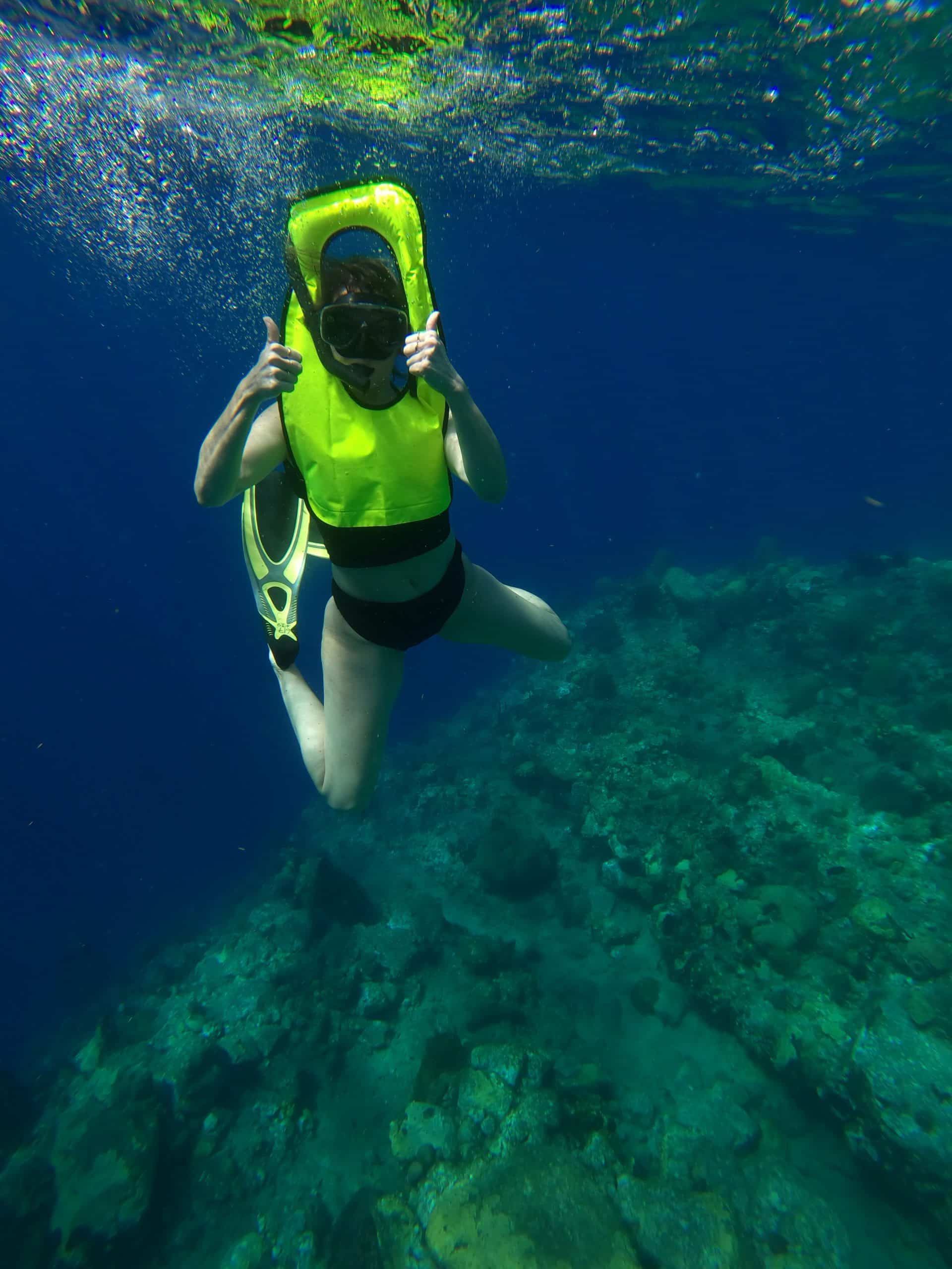 Volunteer diver monitoring coral reefs during a marine conservation project in Thailand. Volunteer diver monitoring coral reefs during a marine conservation project in Thailand.
