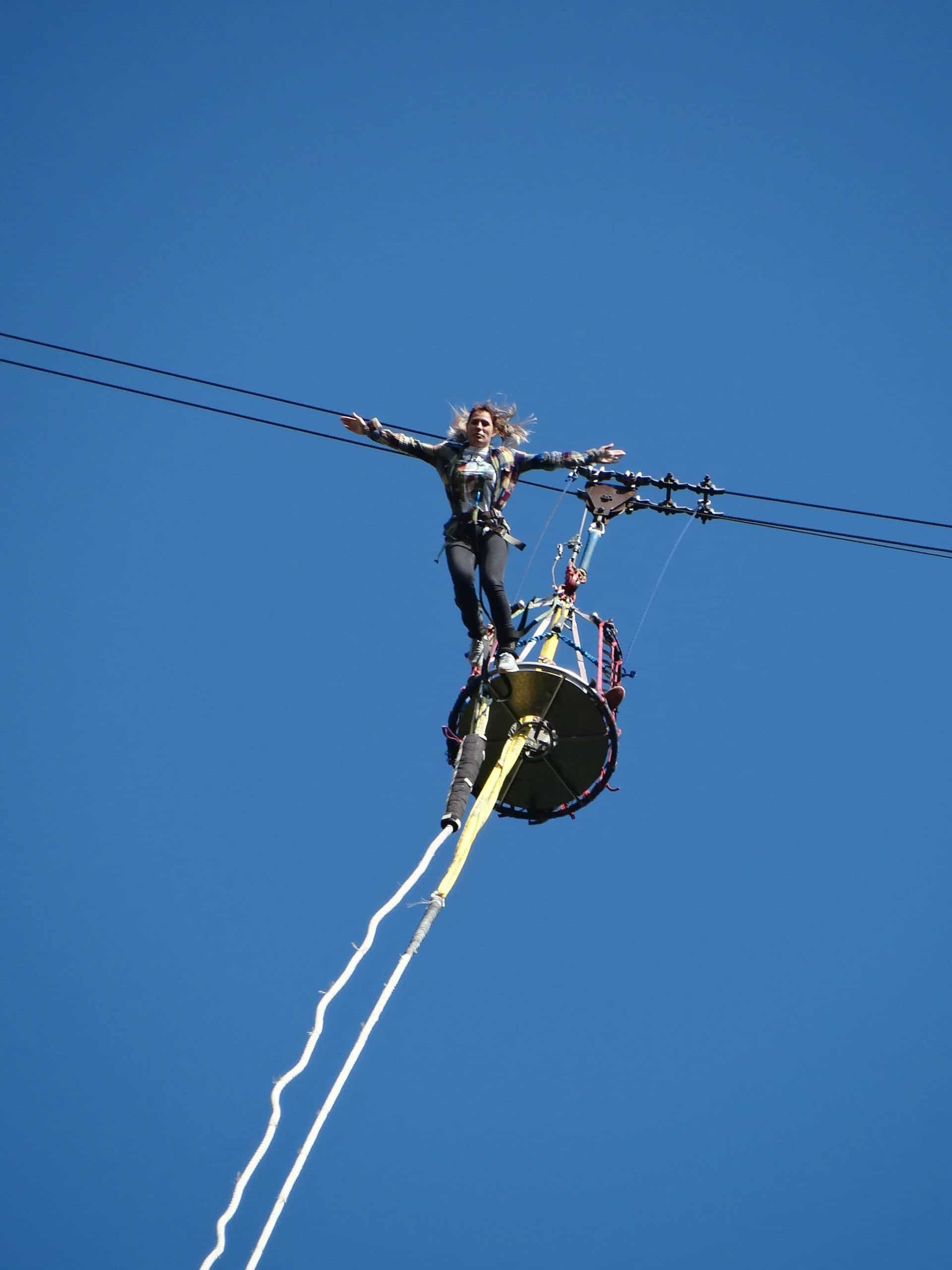 Female traveler bungee jumping over Kawarau Gorge, New Zealand Female traveler bungee jumping over Kawarau Gorge, New Zealand