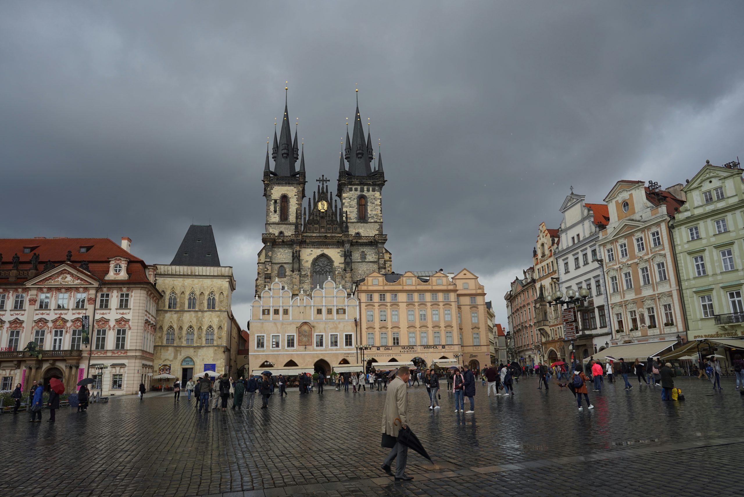 Prague Old Town square with the Astronomical Clock and colorful buildings Prague Old Town square with the Astronomical Clock and colorful buildings