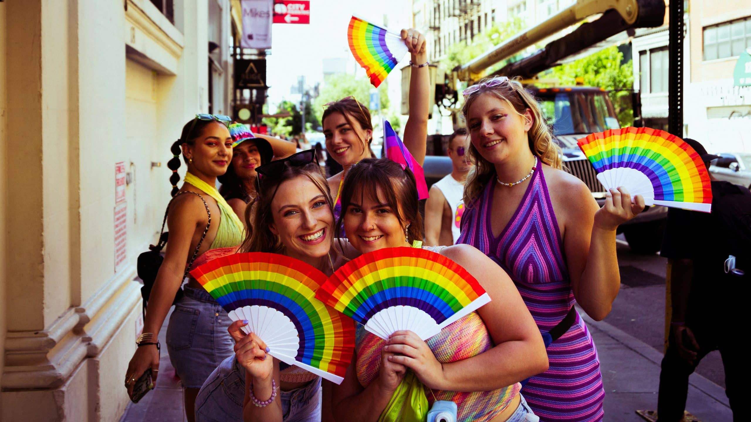 A group of women walking together along Rainbow Row