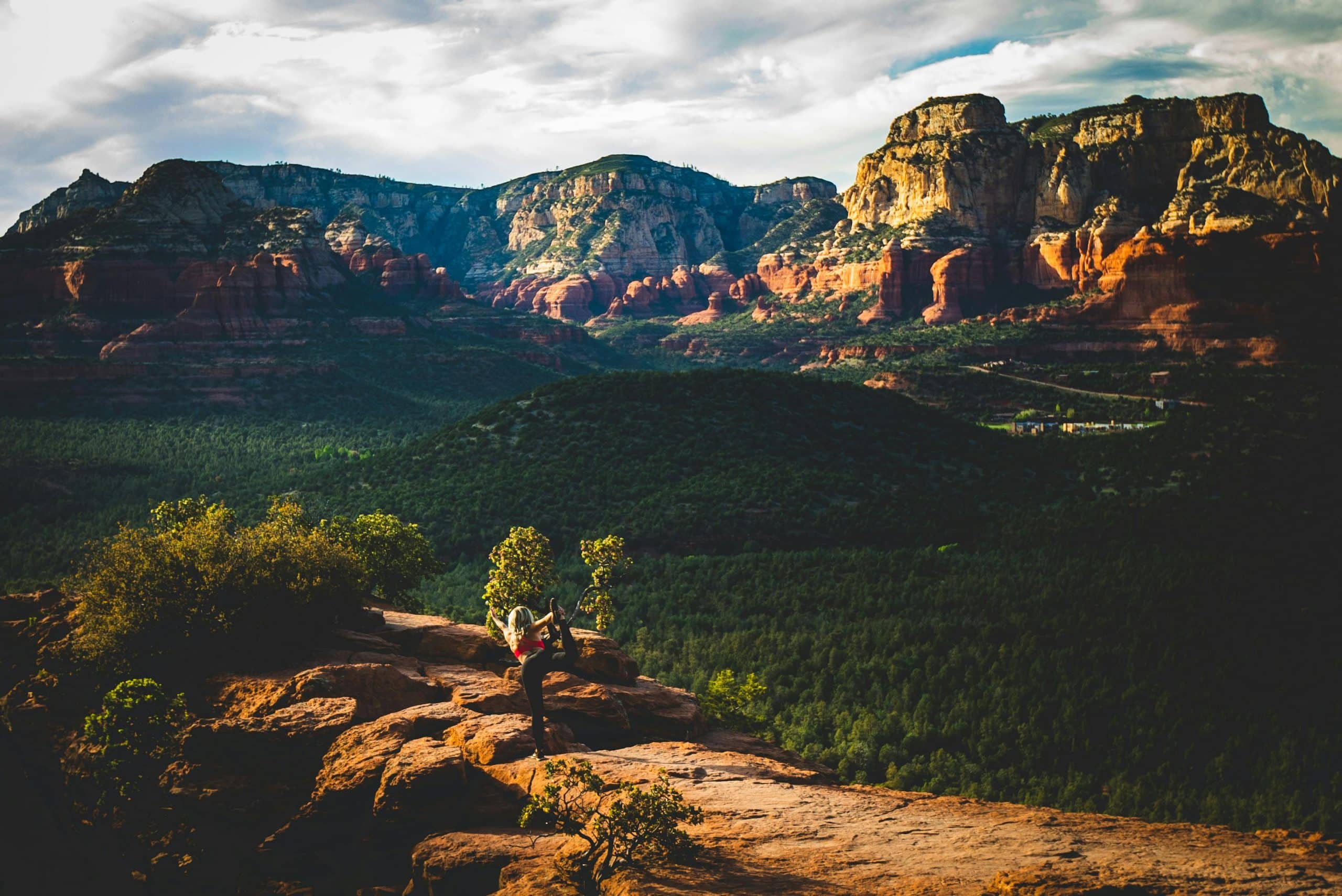 Women doing Yoga with Sedona mountains view