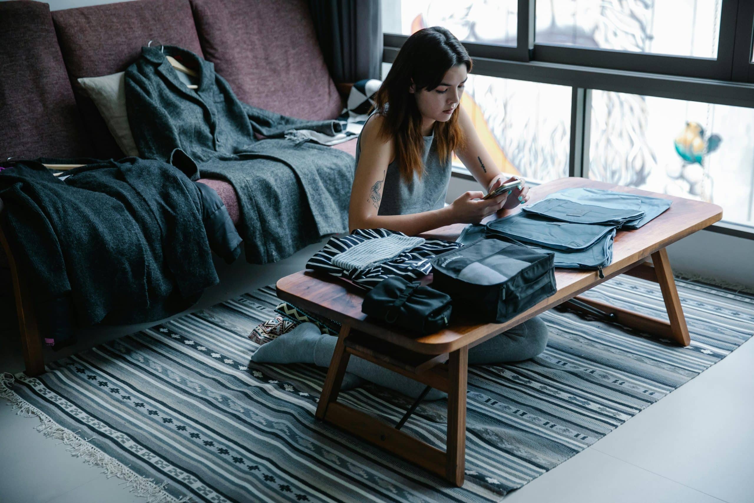 Women using compression packing cubes Women using compression packing cubes