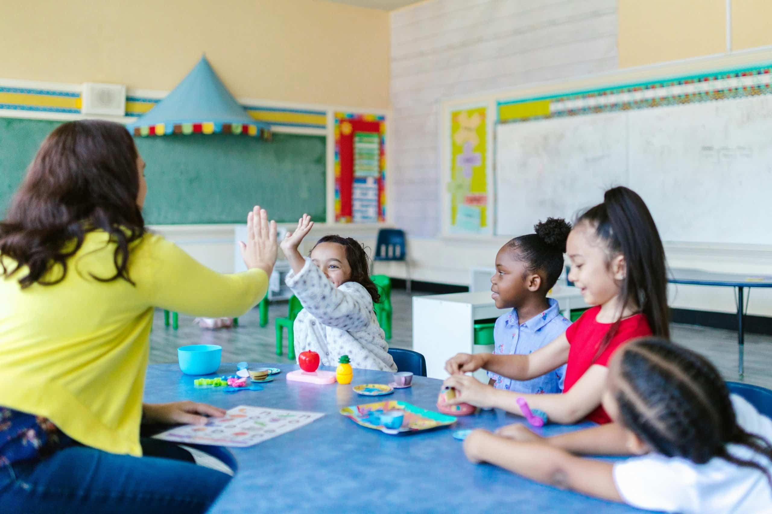 Woman teaching kids Woman teaching kids