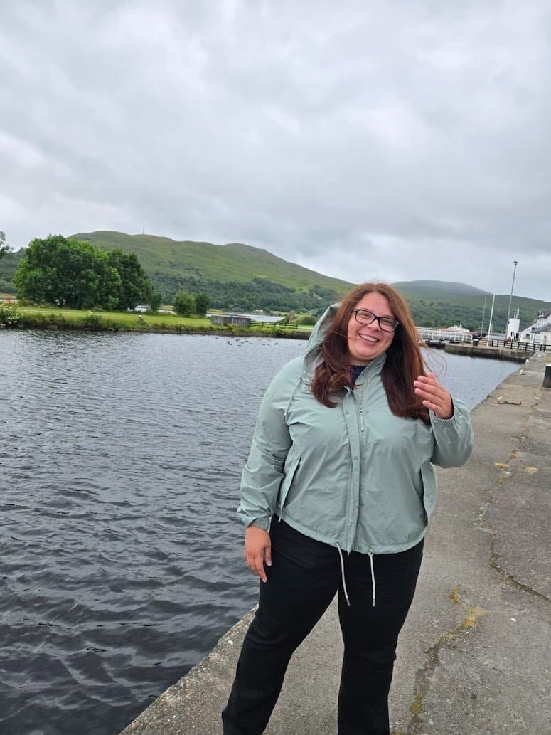 A WTA traveler feeling the wind in her hair in Scotland