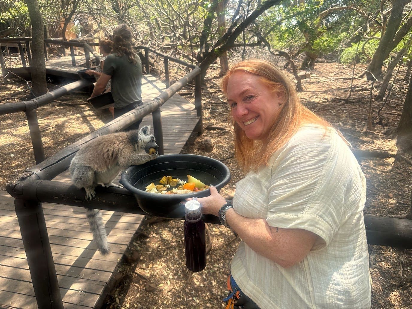 A WTA traveler feeding monkeys in South Africa