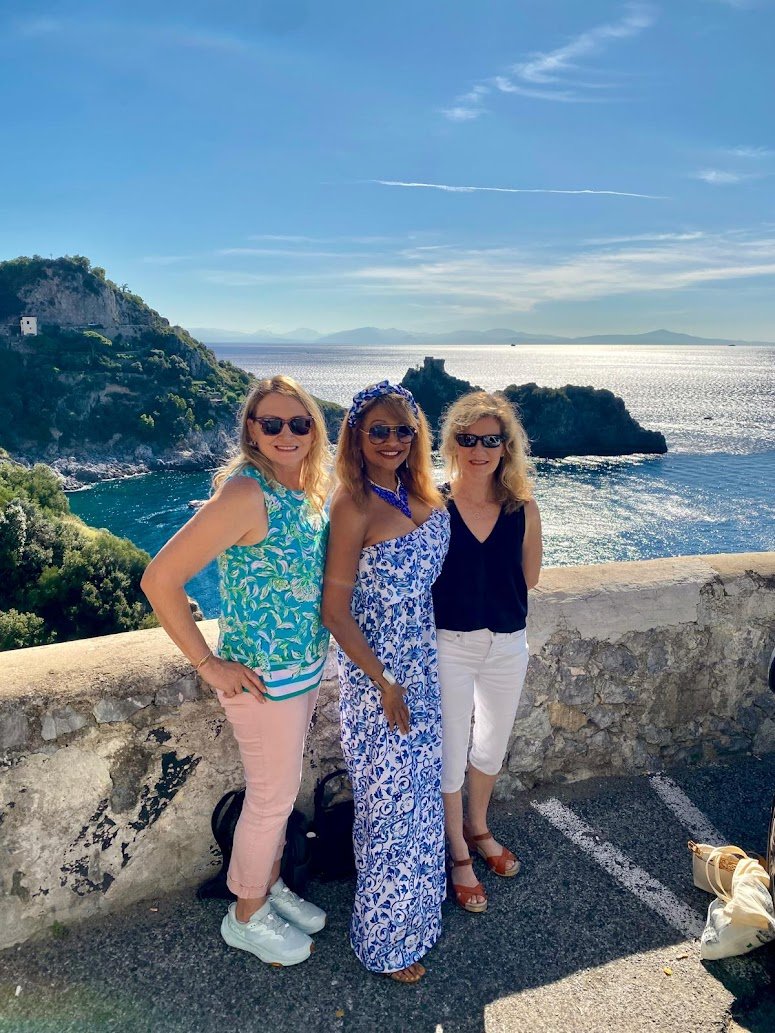 a0f0210e-247e-45f2-97f5-a6c607e984dc WTA travelers marveling at the sunny Amalfi Coast