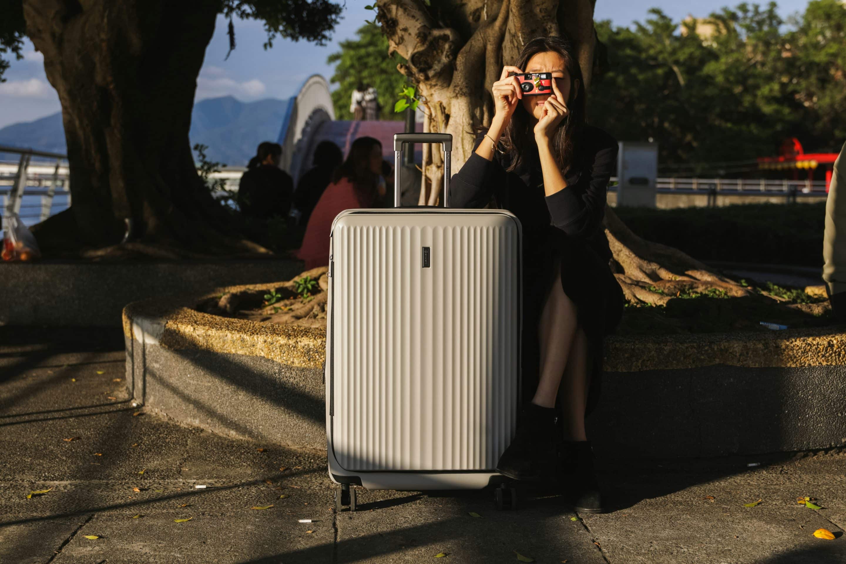eminent-luggage-g2SaMGoYRL8-unsplash A woman with her luggage