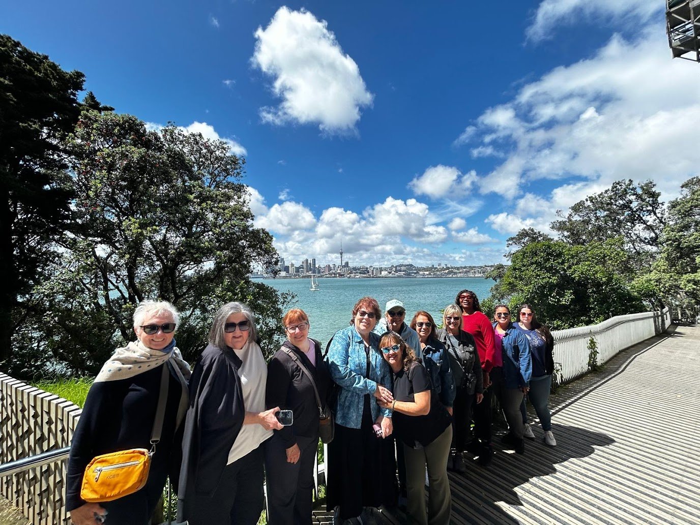 4156fd22-e89b-413e-8e10-eeac9ca79e02 WTA travelers posing in sunny New Zealand