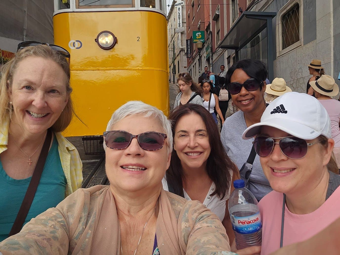 WTA women posing near a rail car in El Camino
